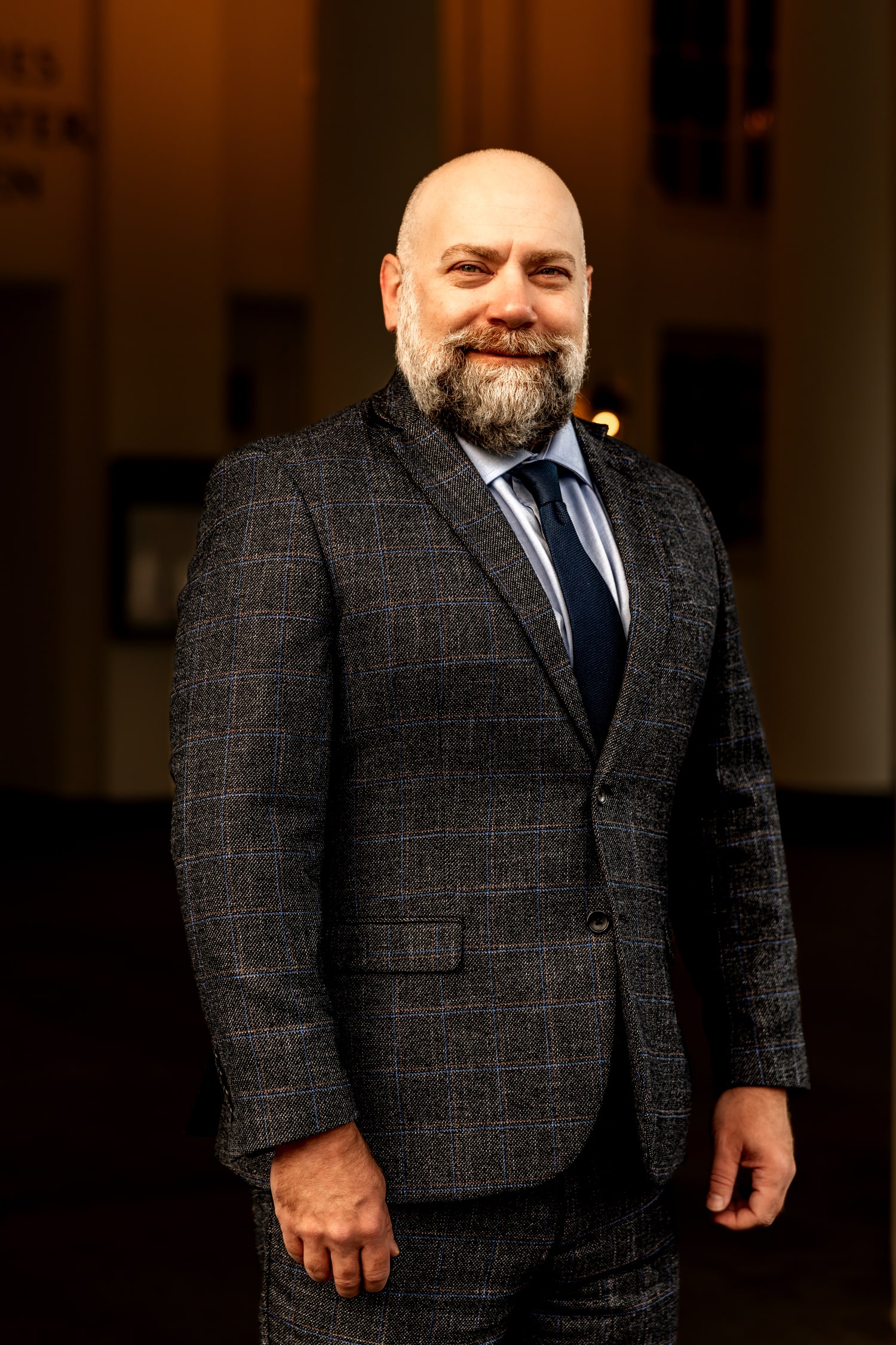 Matthew Krause in a checkered suit and blue tie
