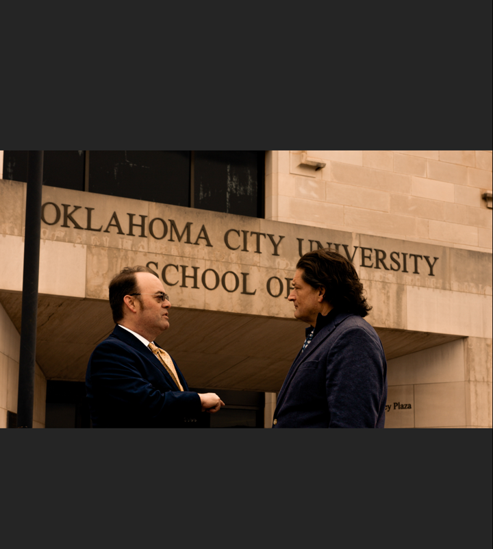 Robert Newark talking with Will M. Helixon in front of Oklahoma City University School of Law