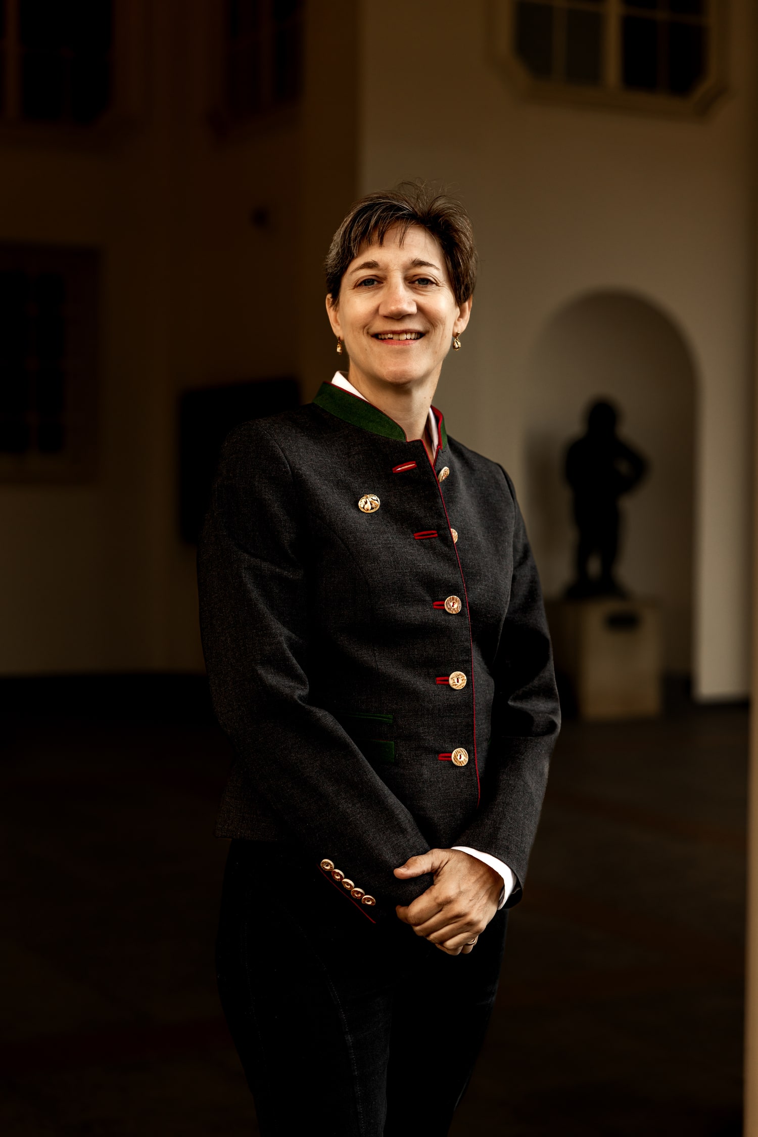 Portrait of military attorney Mary Ritzman in formal jacket