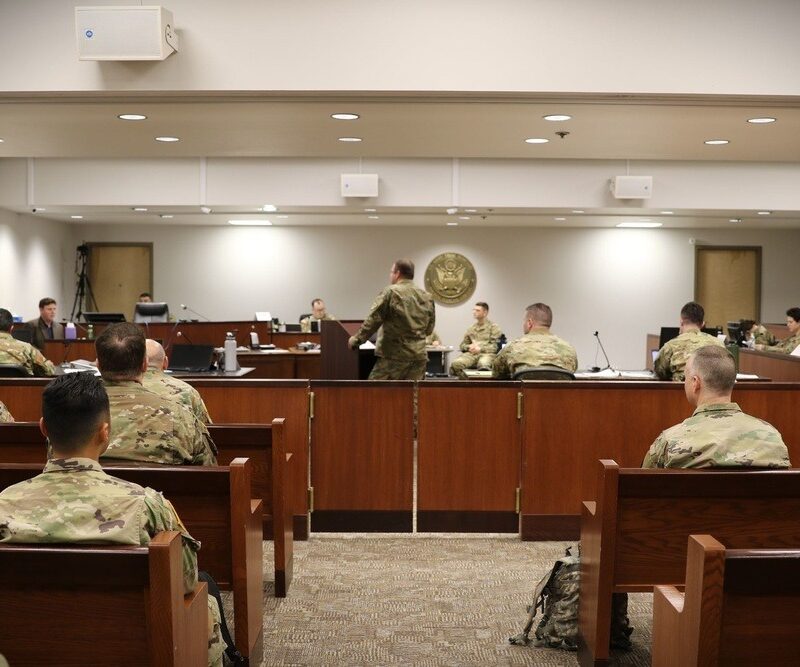TJAGLCS advises the recorder and defense counsel in front of the board members during the mock administrative separation board