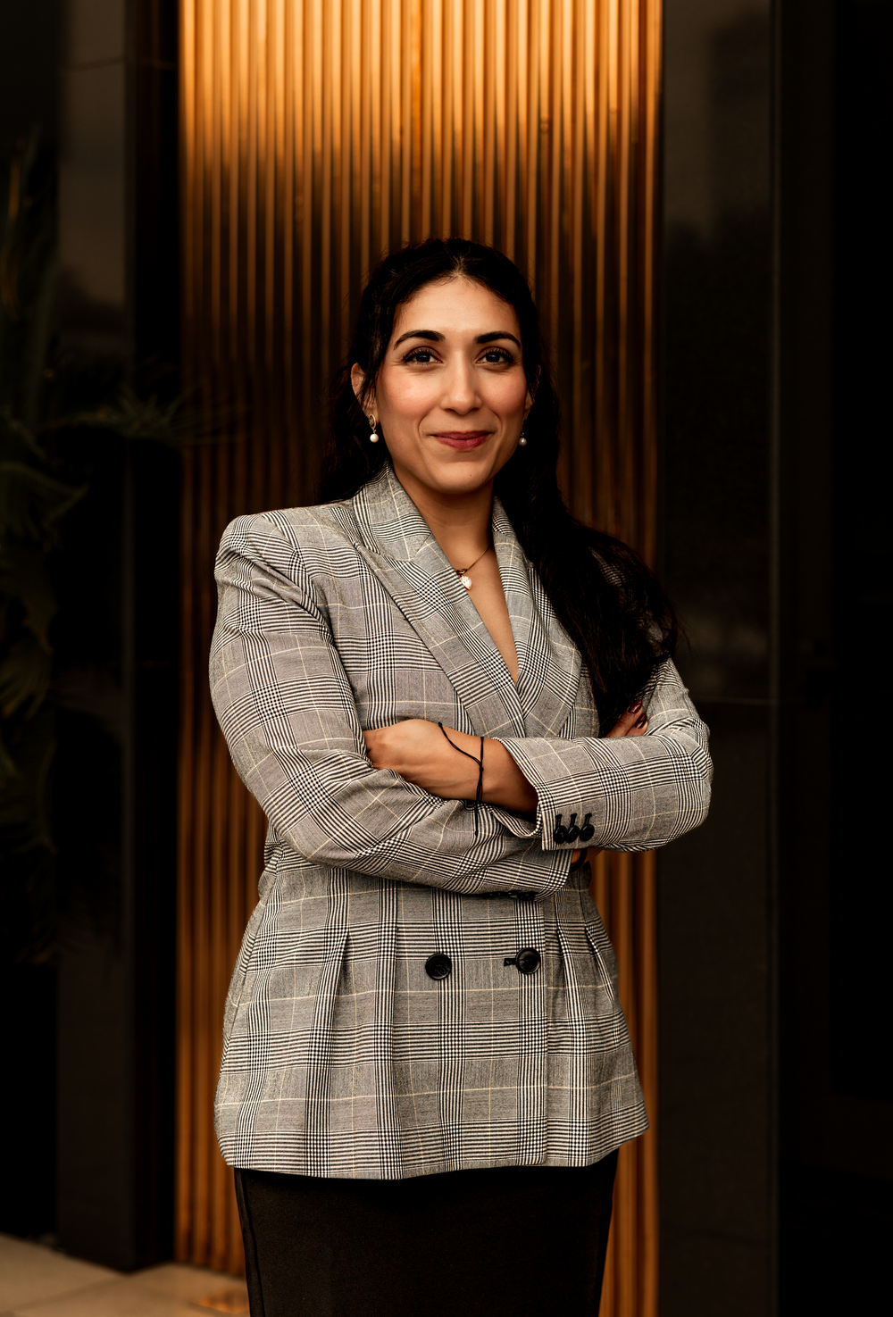 Military defense lawyer Linda Aguilera with arms crossed, photographed at a slight angle